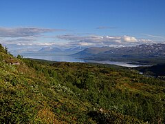 Rohkunborri is located adjacent to Sweden, near the large lake Torneträsk