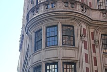 Windows on the building's rounded corner