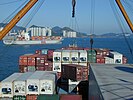 A container is lifted from the deck.