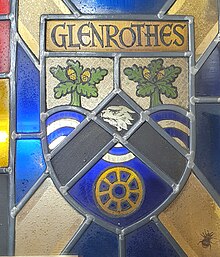 Former Coat of Arms of the Glenrothes Development Corporation enshrined in a stained glass window on display in the Rothes Halls in Glenrothes, Fife. The Coat of Arms depicts oak trees over the River Leven, the head of an otter within a chevron and the winding wheel of the former Rothes Colliery at the bottom.