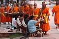 Image 18Monks gathering morning alms (from Culture of Laos)