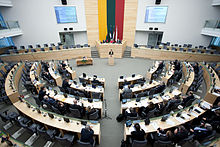 A large room with horseshoe-shaped seating, seen from above