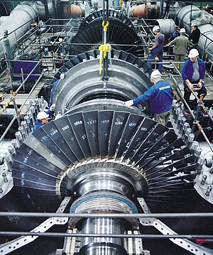 Photo of technicians working on a steam turbine