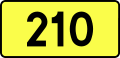 English: Sign of DW 210 with oficial font Drogowskaz and adequate dimensions.