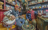 Tunisia, 2017. Musician playing large-bodied gombri.