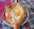 * Nomination Adjaruli Khachapuri, a georgian bread filled with cheese and eggs --Nikodem Nijaki 09:37, 21 March 2013 (UTC) * Decline Interesting food but: unsharp and unfortunate crop. Especially beginning and end of the bread would be of interest. --Tuxyso 16:48, 21 March 2013 (UTC)