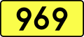 English: Sign of DW 969 with oficial font Drogowskaz and adequate dimensions.