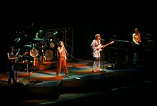 A color photograph of members of the band Yes on stage