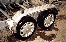 A tandem axle on a small trailer