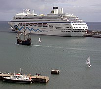 Santa Maria, Columbus' flagship, in front of the cruise ship AIDAblu