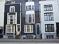 Black mathematical tiles on houses with unusual offset bay windows on Grand Parade Location on Google Maps