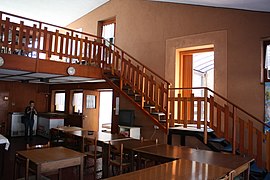 The staircase taking to the upstairs balcony with the two doors connecting the Meeting to the Montanina; there is also an upstairs access.