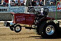 Tractor performing a wheelie