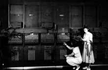 Marlyn Wescoff, standing, and Ruth Lichterman reprogram the ENIAC in 1946.