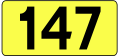 English: Sign of DW 147 with oficial font Drogowskaz and adequate dimensions.