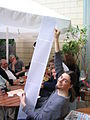 Kurt Jansson, president of Wikimedia Deutschland, holding a list with 10000 Wikipedia authors.