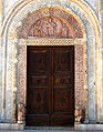 Central portal; in the lunette : Christ enthroned between the sun and the moon, aside: San Rufino and the Virgin and Child