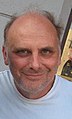 Kurt Fuller interpreta Woody il coroner