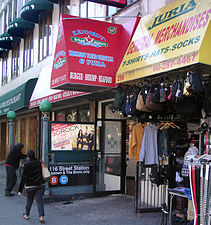 116th Street at Eighth Avenue in Harlem, and the uptown entrance to 116th Street station (A, ​B, and ​C trains).