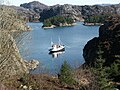 Fishing vessel anchored in a bay.