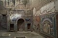 Le triclinium d'été de la maison de Neptune et Amphitrite avec son nymphaeum decoré de mosaïques pariétales.