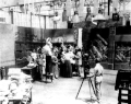 Image 18A.E. Smith filming The Bargain Fiend in the Vitagraph Studios in 1907. Arc floodlights hang overhead. (from History of film)