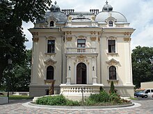 Exterior of a square, white building