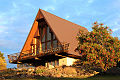 An A-frame house, the simplest framing but long rafters are needed.