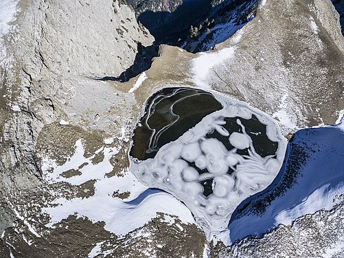 Air view of Dragon Lake on Mount Tymfi Photograph: Piterpanos