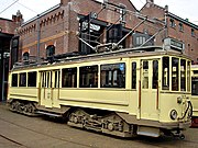 Gele Tram motorwagen 57 van de tram naar Wassenaar in het Haags Openbaar Vervoer Museum