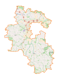 Mapa konturowa powiatu lubelskiego, blisko centrum na prawo znajduje się punkt z opisem „Dominów”