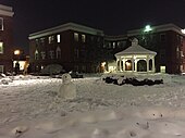 Snowman in an apartment courtyard at night in Virginia, United States