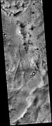 Lau Crater, as seen by CTX camera (on Mars Reconnaissance Orbiter). Curved ridges are probably eskers which formed under glaciers.