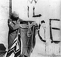 Sikh soldier with captured Swastika flag