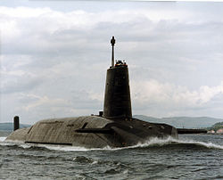 A dark grey submarine slightly visible above water.