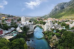 次席 : Stari Most, the "Old Bridge", which connects the two banks of river Neretva, has been a symbol of Mostar for centuries. This view from north shows Helebija tower to the left and Tara tower to the right. It was made from the minaret of Koski Mehmed Pasha Mosque. (POTD) – Credit: Own work by Ramirez. (GFDL, CC-BY-SA-3.0,2.5,2.0,1.0)