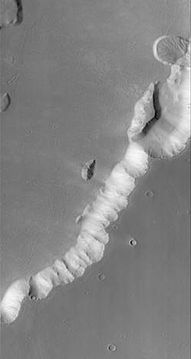 Echus Montes, as seen CTX. Click on image to see a semi-circular deposit (in the upper right) that is a landslide.