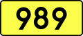 English: Sign of DW 989 with oficial font Drogowskaz and adequate dimensions.