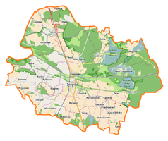 Mapa konturowa gminy Żmigród, blisko centrum u góry znajduje się punkt z opisem „Borek”