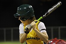 woman holding softball bat