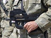 Photo of a Cypriot National Guard member carrying a P90 during a parade in Larnaca