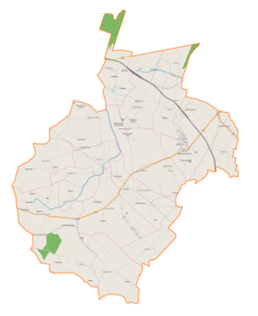 Mapa konturowa gminy Wojciechowice, blisko centrum na dole znajduje się punkt z opisem „Parafiapw. świętej Teresy od Dzieciątka Jezusw Stodołach”