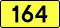 English: Sign of DW 164 with oficial font Drogowskaz and adequate dimensions.