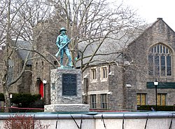 northeast at statue and Community Church of the Circle in Mount Vernon on a cloudy afternoon