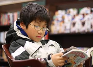 A boy reading manga