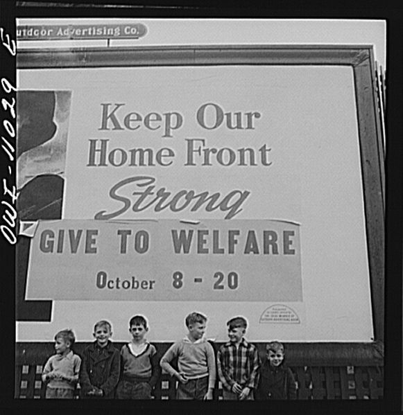 File:Boys playing near a billboard.8d23451v.jpg