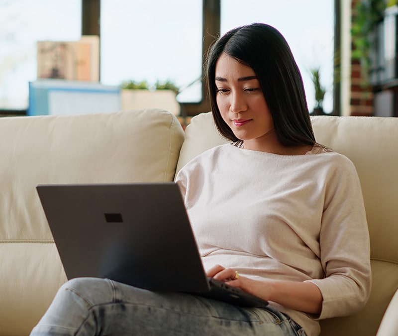 An image of a woman removing bloatware from her computer.