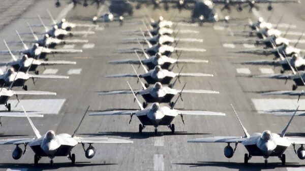 U.S. Air Force F-22 Raptors, E-3 Sentrys, C-17 Globemaster IIIs, C-130J Herculeses and C-12F Hurons participate in a close formation taxi known as an elephant walk at Joint Base Elmendorf-Richardson, Alaska, May 5, 2020. This event displayed the ability of the 3rd Wing, 176th Wing and the 477th Fighter Group to maintain constant readiness throughout COVID-19 by Total Force Integration between active-duty, Guard and Reserve units to continue defending the U.S. homeland and ensuring a free and open Indo-Pacific. (U.S. Air Force photo by Senior Airman Jonathan Valdes Montijo)