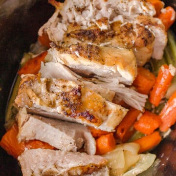 slow cooker turkey breast with carrots and celery in a slow cooker