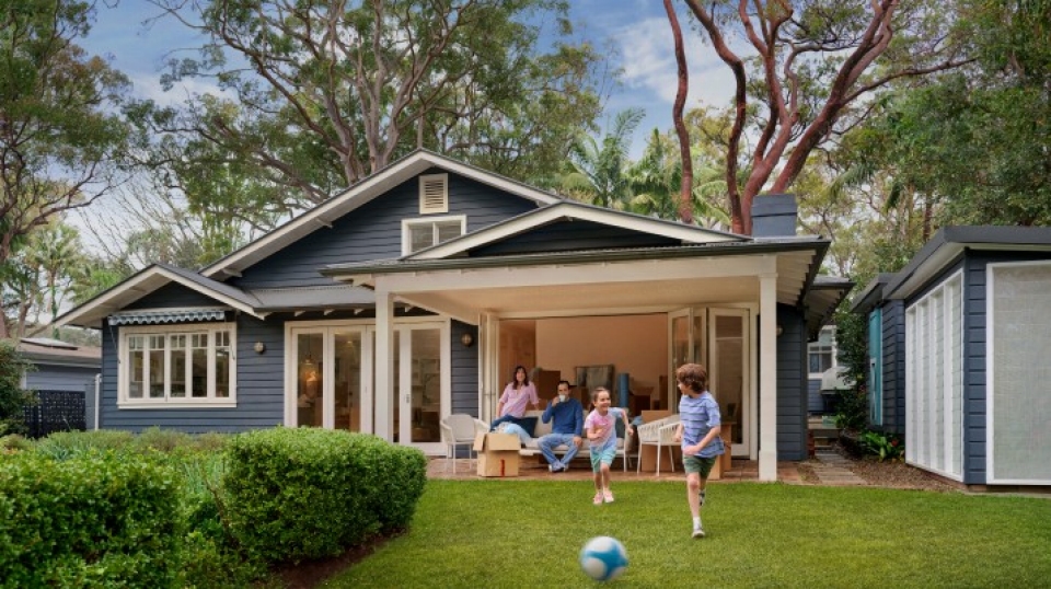 Family house with kids playing in yard